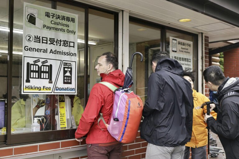 At the foot of Mount Fuji | Hikers in favor of paying an access fee