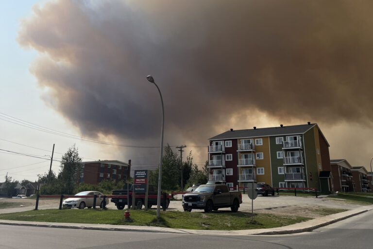 Ground assault begins on wildfire threatening Labrador City