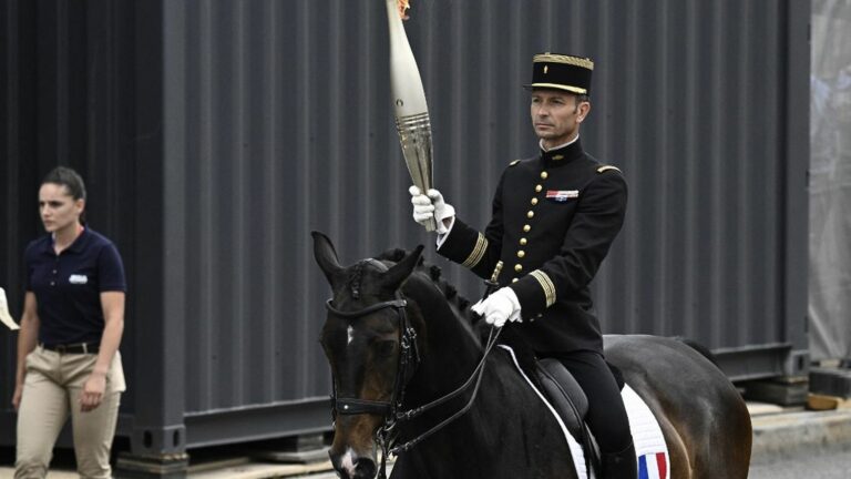 The Olympic flame is invited to the July 14 festivities in Paris