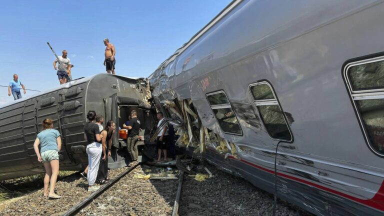 Train derails after collision with truck, over 100 injured