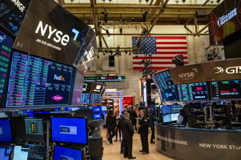 Wall Street rises, driven by bond yields and corporate earnings