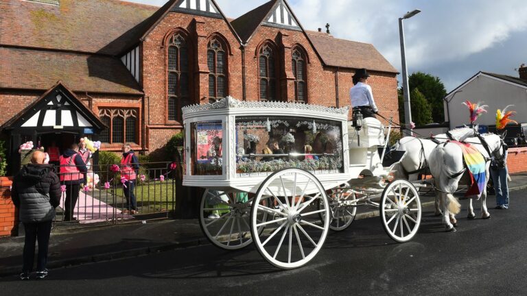 Balloons, stuffed animals and emotion at the funeral of a 7-year-old girl