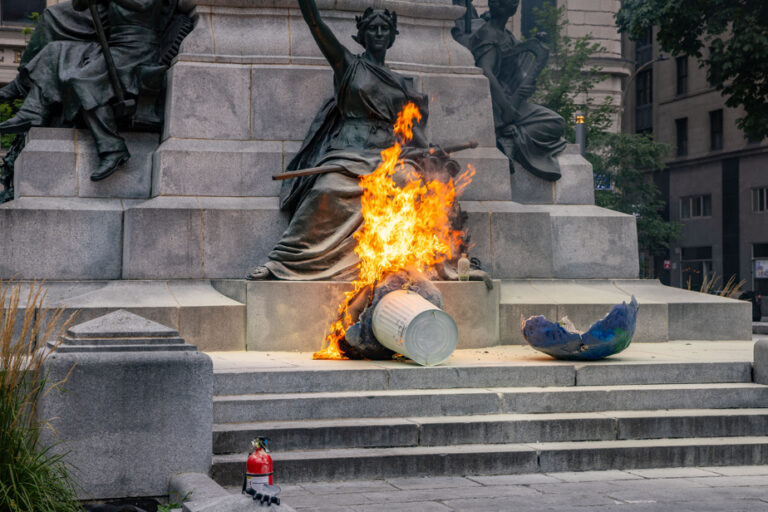 Demonstration against climate inaction | Protesters set fire to papier-mâché planet in Phillips Square