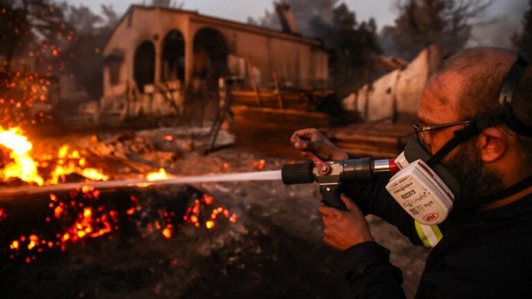 Faced with fires ravaging the suburbs of Athens, many Greeks are forced to evacuate