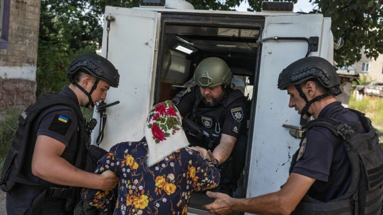 In Ukrainsk, Donbass, a volunteer rescuer evacuates the last Ukrainian civilians