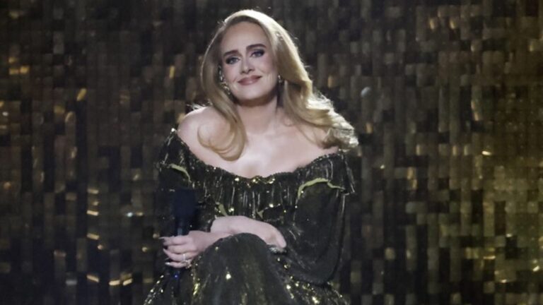 In the middle of a concert, Adele stops singing to broadcast the women’s 100m on a big screen