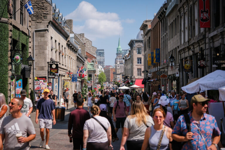 Vacationers in Old Montreal | Tourists by the thousands, but spending moderately