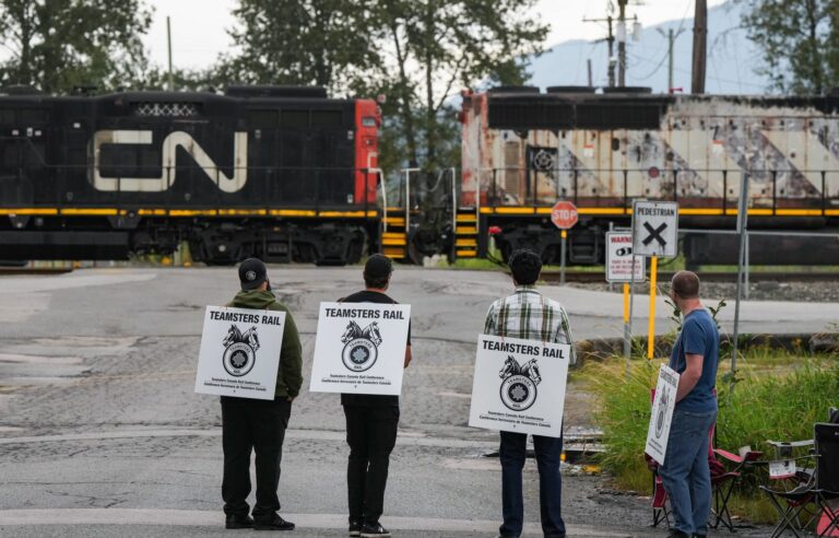 What are the stakes in the negotiations leading to the rail lockouts?