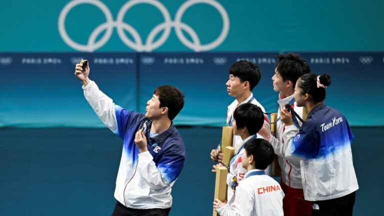 What happens to the “victory selfies” taken by medalists on the podium?