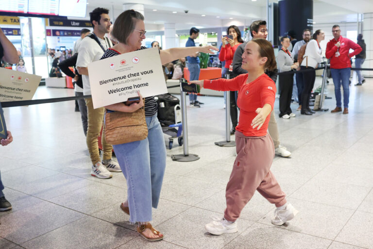 Proud athletes return home