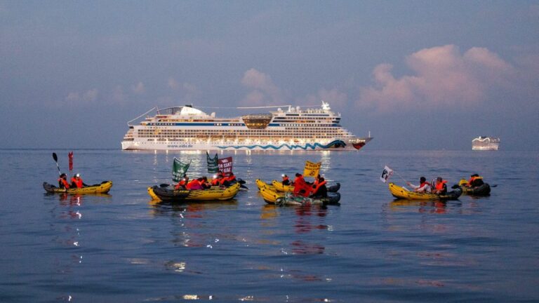 Stop Cruises and Extinction Rebellion activists block cruise ships at the entrance to Marseille port