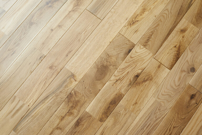 Tell me, human | What is the best way to clean wooden floors without damaging them?