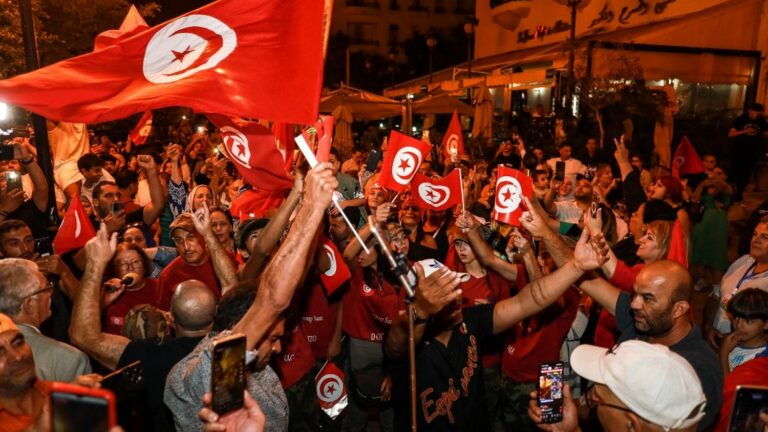 in Tunisia, supporters of the outgoing president who won the election celebrate his victory