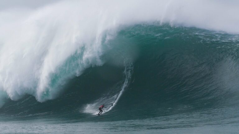 World Champion Surfer Reflects on Near-Death Experience and Journey to Record-Breaking Success