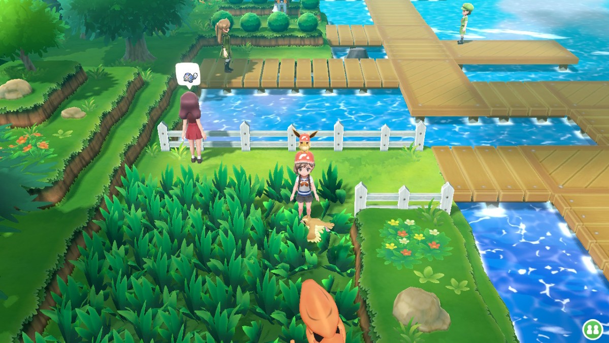 Capture d'écran de Pokemon Let's Go Eevee, montrant l'entraîneur marchant dans les hautes herbes avec des apparitions de Pokémon visibles