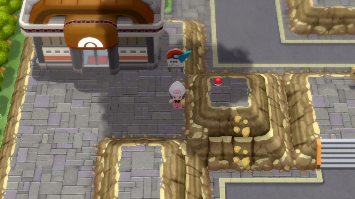 Capture d'écran de Pokemon Brilliant Diamond, montrant un avatar debout près d'un objet trouvé au sol