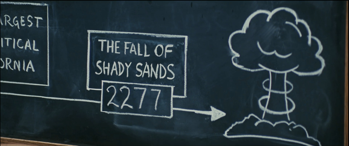 Une capture d'écran de la saison 1 de Fallout, d'un dessin au tableau qui dit 