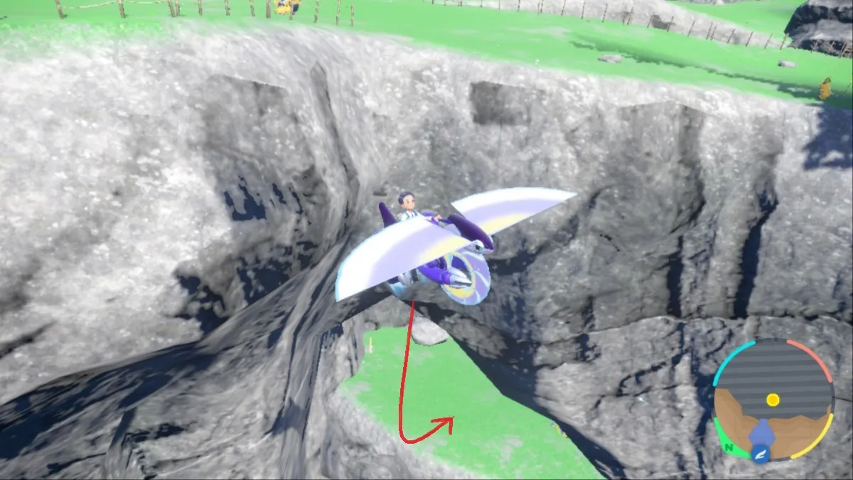 Capture d'écran de Pokémon Écarlate et Violet de Miraidon glissant au-dessus d'une alcôve dans la zone zéro avec une flèche rouge pointant vers l'emplacement d'Iron Crown