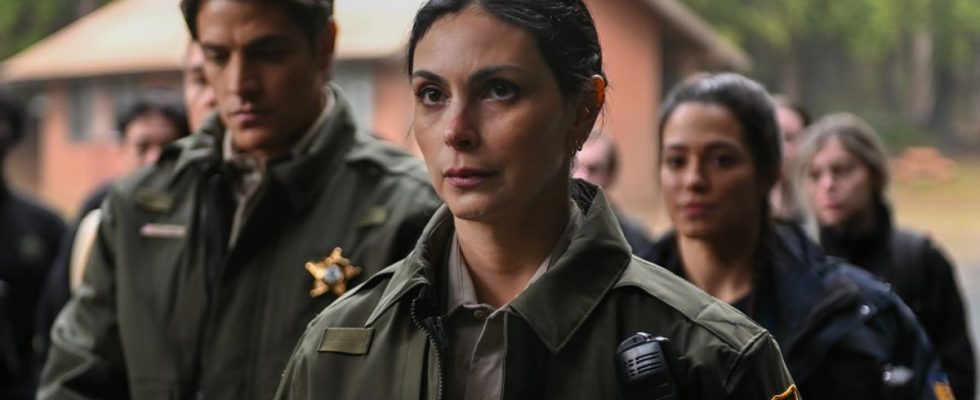 Morena Baccarin standing in front of other officers from the Sheriff