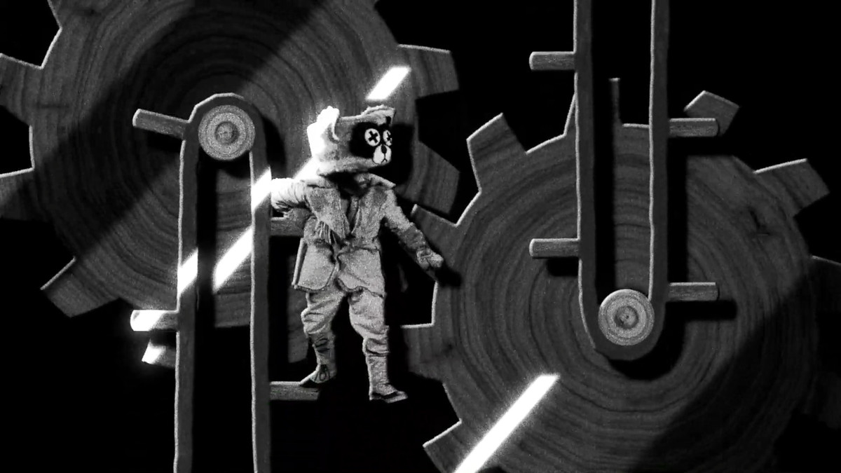 Un homme en tenue de castor est pris dans les rouages ​​d'une machine, un peu comme Charlie Chaplin dans Les Temps Modernes, dans Des centaines de castors