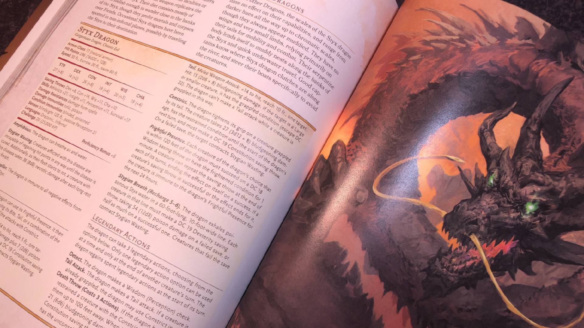 Pages ouvertes de Chains of Asmodeus, y compris une illustration d'un dragon