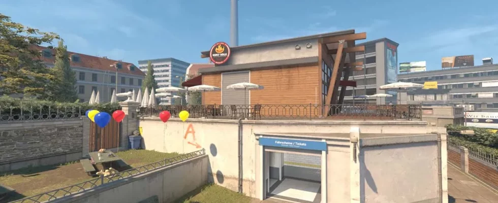 CS2's Overpass map, showing the grassy party area and ticket office in the middle of the map.