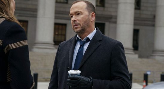 Donnie Wahlberg as Danny Reagan in Blue Bloods holding a cup of coffee.