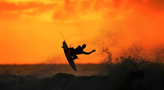 BELLS BEACH, AUSTRALIA - MARCH 27: A surfer warms up at sunrise ahead of the 2024 Rip Curl Pro Bells Beach on March 27, 2024 in Winkipop, Australia.  (Photo by Morgan Hancock/Getty Images)