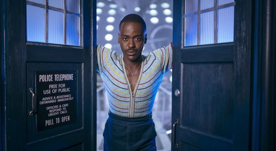 Ncuti Gatwa as The Doctor standing in the TARDIS doors