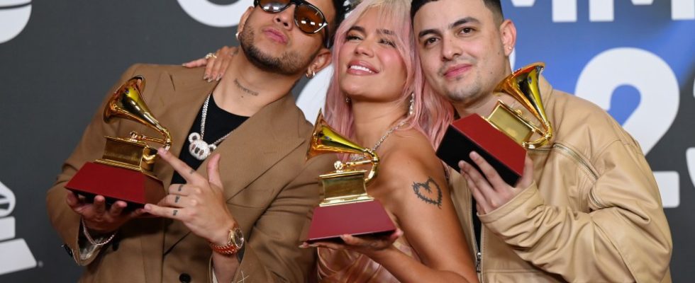 SEVILLE, SPAIN - NOVEMBER 16: (L-R) Ovy On The Drums, Karol G, and  Kevyn Mauricio Cruz pose with awards during The 24th Annual Latin Grammy Awards on November 16, 2023 in Seville, Spain. (Photo by Borja B. Hojas/Getty Images for Latin Recording Academy)