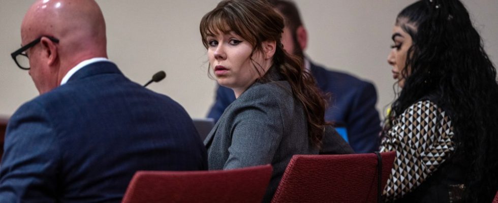 Hannah Gutierrez-Reed, center, sits with her attorney Jason Bowles, left, during the first day of testimony in the trial against her in First District Court, in Santa Fe, N.M., Thursday, February 22, 2024. Gutierrez-Reed, who was working as the armorer on the movie "Rust" when a revolver actor Alec Baldwin was holding fired killing cinematographer Halyna Hutchins and wounded the film’s director Joel Souza, is charged with involuntary manslaughter and tampering with evidence.