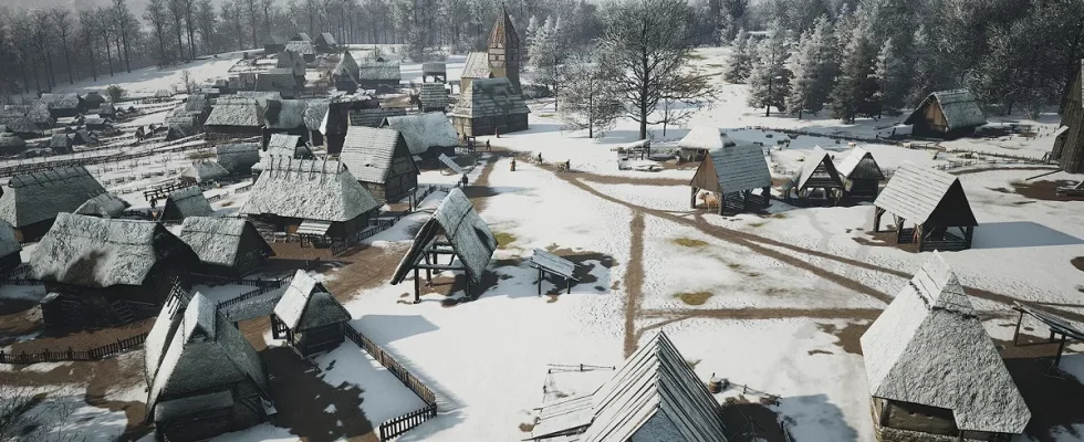 Manor Lords: a wide angle shot showing a snowy village.