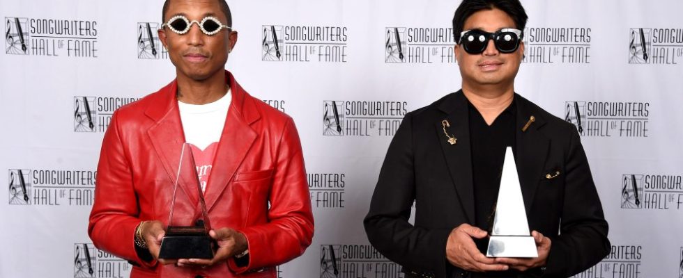 NEW YORK, NEW YORK - JUNE 16: Inductees Pharrell Williams and Chad Hugo of The Neptunes pose backstage at the Songwriters Hall of Fame 51st Annual Induction and Awards Gala at Marriott Marquis on June 16, 2022 in New York City. (Photo by Gary Gershoff/Getty Images for Songwriters Hall of Fame )