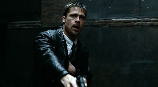 Brad Pitt in the rain with a gun in Se7en