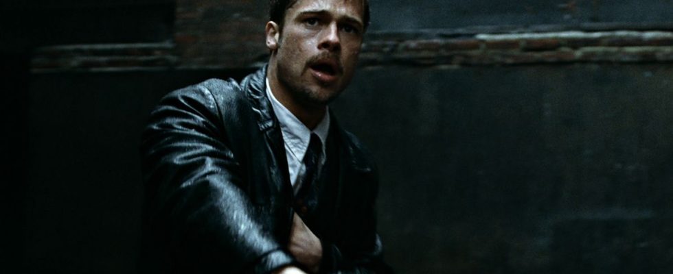 Brad Pitt in the rain with a gun in Se7en