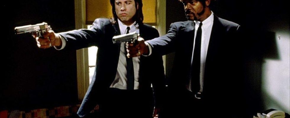 John Travolta and Samuel L. Jackson pointing guns together in Pulp Fiction