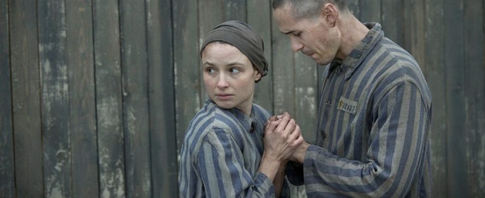Anna Próchniak and Jonah Hauer-King as concentration camp inmates Lale Sokolov and Gita Furman in The Tattooist of Auschwitz