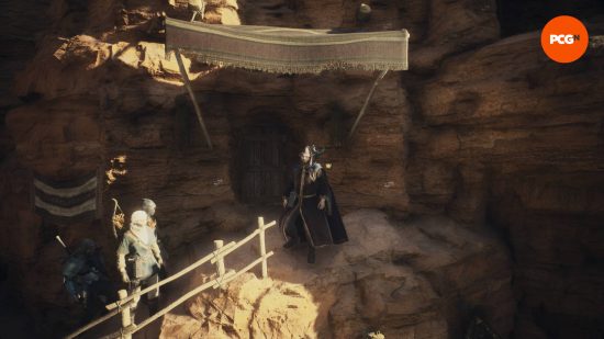 L'Arisen et ses pions se tiennent devant la maison de Dragon's Dogma 2 à Bakbattahl, qui se trouve à l'intérieur d'une montagne.