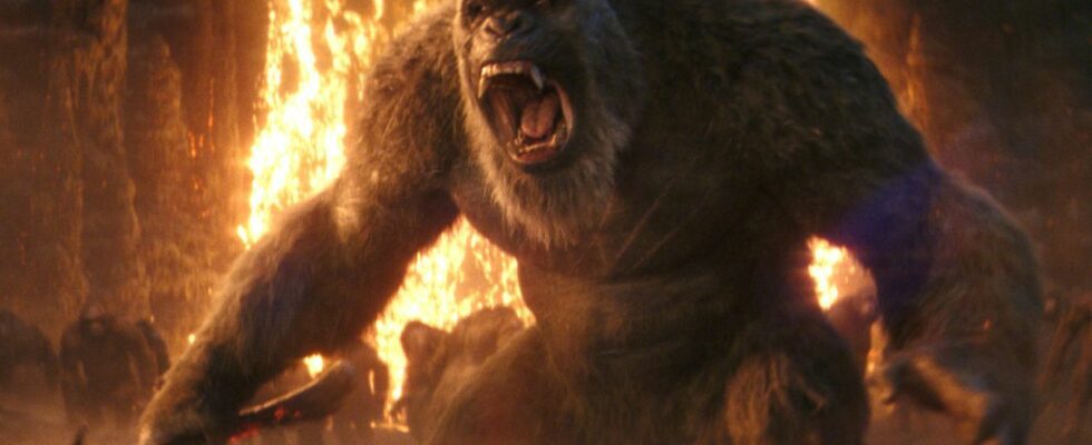 Kong stands roaring in front of lava, while holding an axe in Godzilla x Kong: The New Empire.