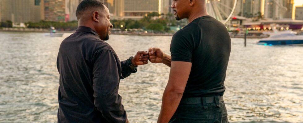 Martin Lawrence and Will Smith fist bump on the water in Bad Boys: Ride or Die.