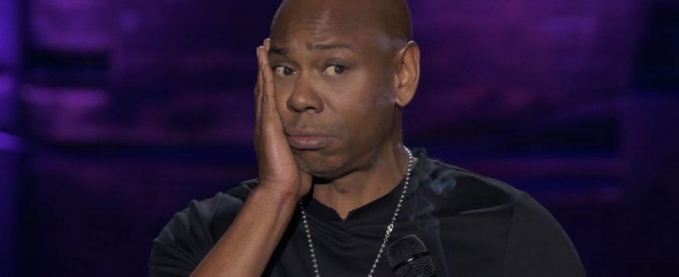 Dave Chappelle with hand on cheek in The Dream stand-up special
