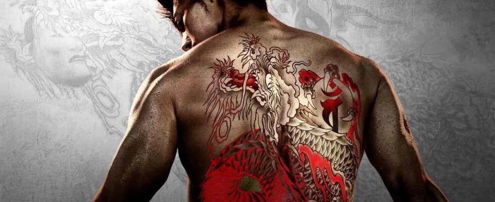 A man standing with his back to camera with a red and black dragon tattoo on his back.