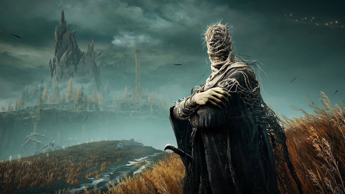 L'un des disciples de Miquella se tient les bras croisés dans un champ herbeux, avec une tour au loin dans une capture d'écran d'Elden Ring : Shadow of the Erdtree.