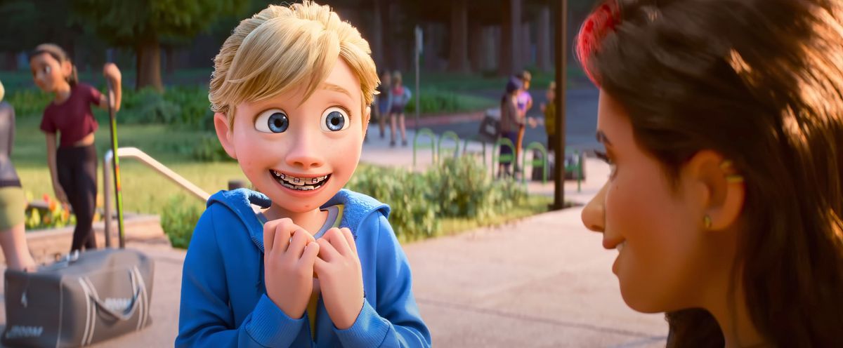 Riley, 13 ans, sourit maladroitement et s'agrippe au col de sa chemise alors qu'elle rencontre Val, son idole de l'équipe de hockey, dans Inside Out 2 des studios d'animation Pixar.