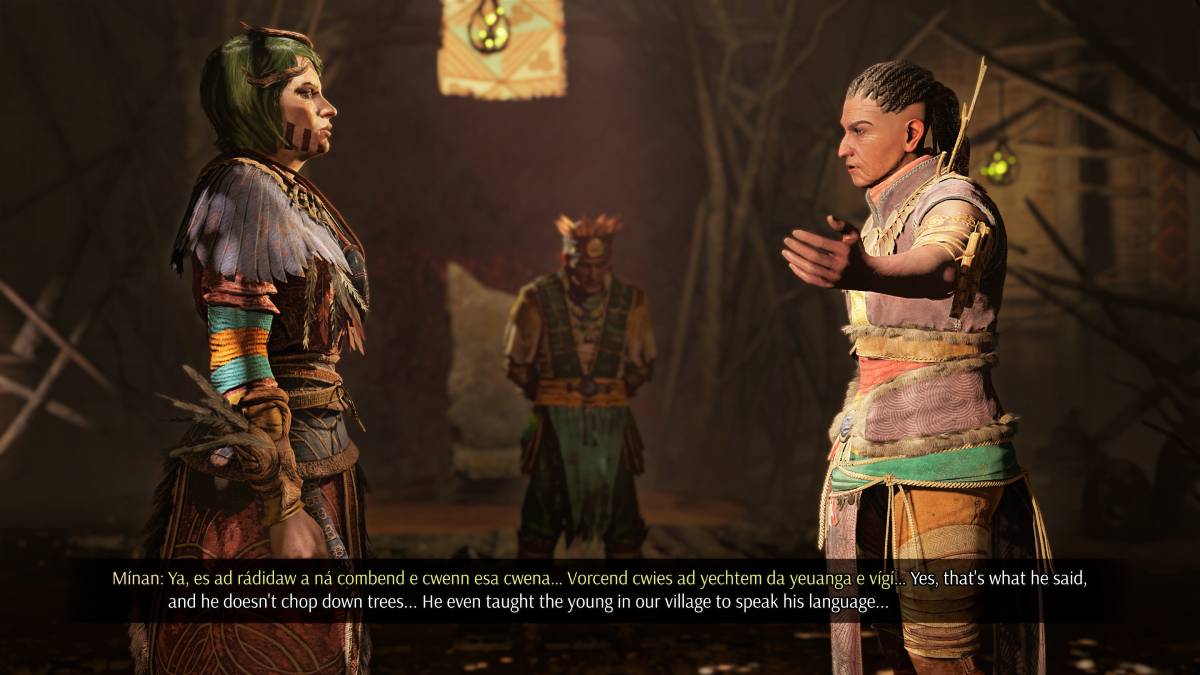 Une capture d'écran de Greedfall 2. Deux personnages se lancent dans une lecture de dialogue : "Oui, c'est ce qu'il a dit, et il n'abat pas d'arbres... Il a même appris aux jeunes de notre village à parler sa langue..."