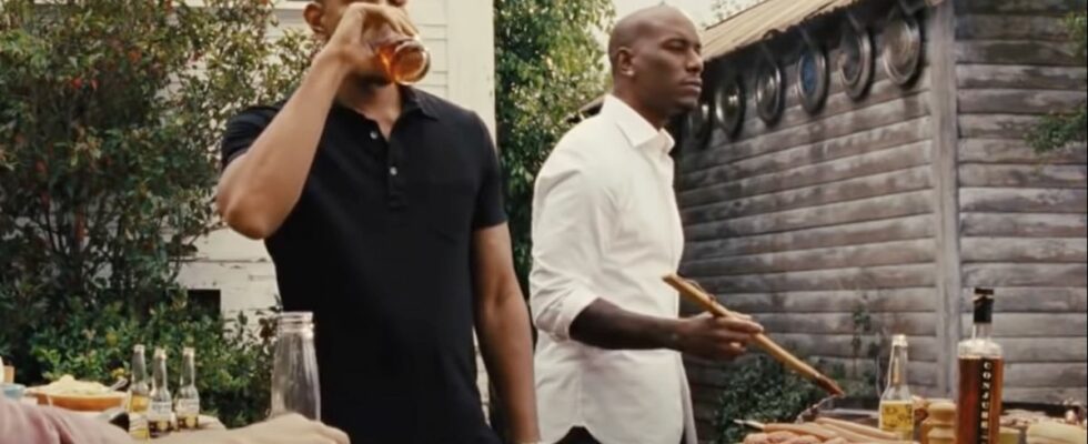 Ludacris sipping drink and Tyrese Gibson working at grill in Fast and Furious 6