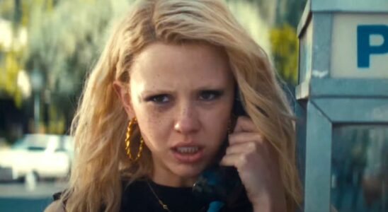 Mia Goth as Maxine Minx talks on a pay phone in the trailer for MaXXXine.