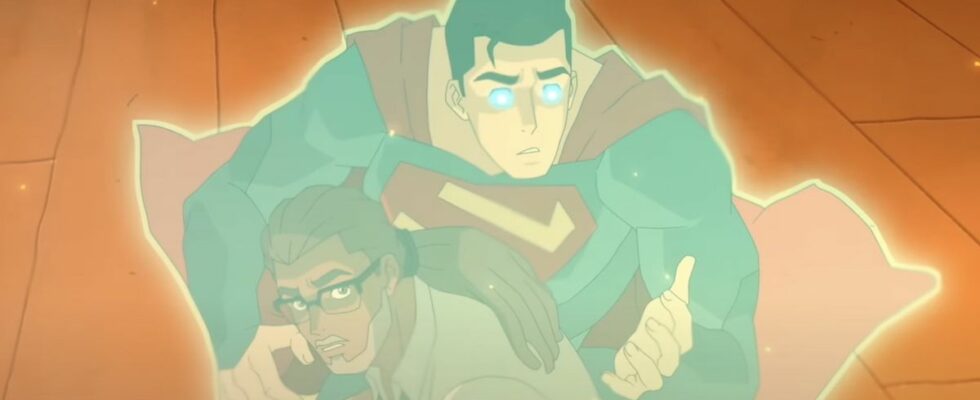 Superman emitting an energy aura protecting him and Silas Stone in burning apartment