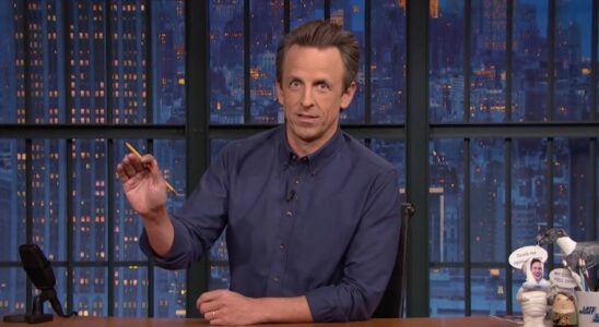 Seth Meyers speaking at his desk on Late Night