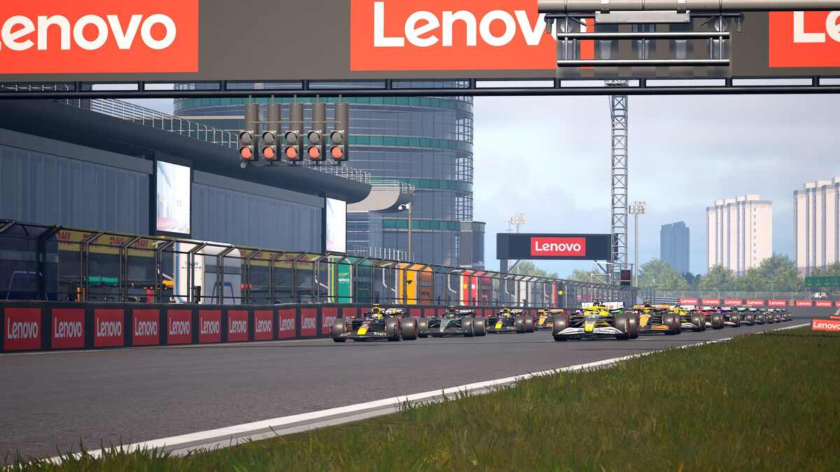 Test de F1 Manager 2024 : Un groupe de voitures F1 sur la grille avant le départ d'une course.